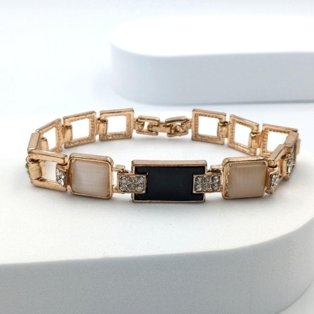 5/25$   Rose gold tone panel bracelet with rhinestones